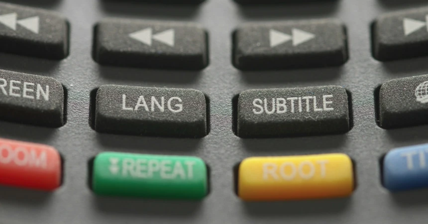 Image of buttons on a remote control. Lang, subtitle buttons can be seen.
