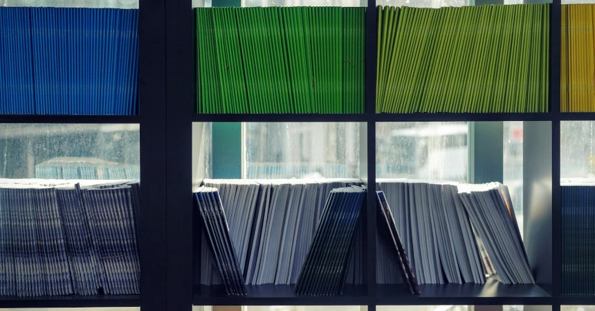 A bookcase with colorful books in it